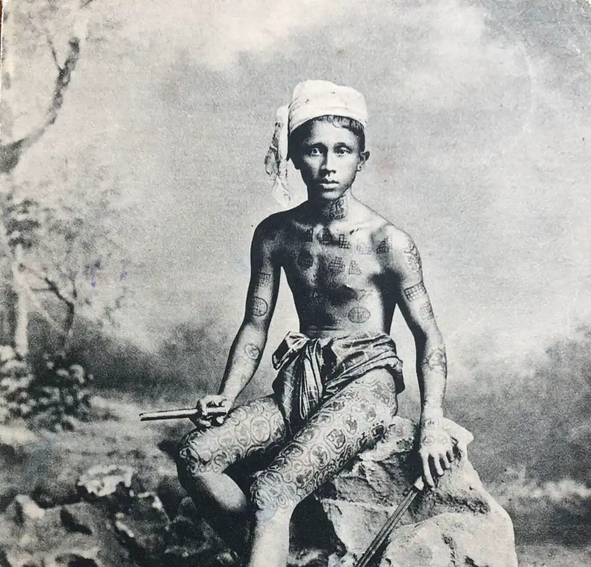 Photo postcard displacing tattooed Burmese villager, first decade of XIX century, from the private collection of Gabriele Gori