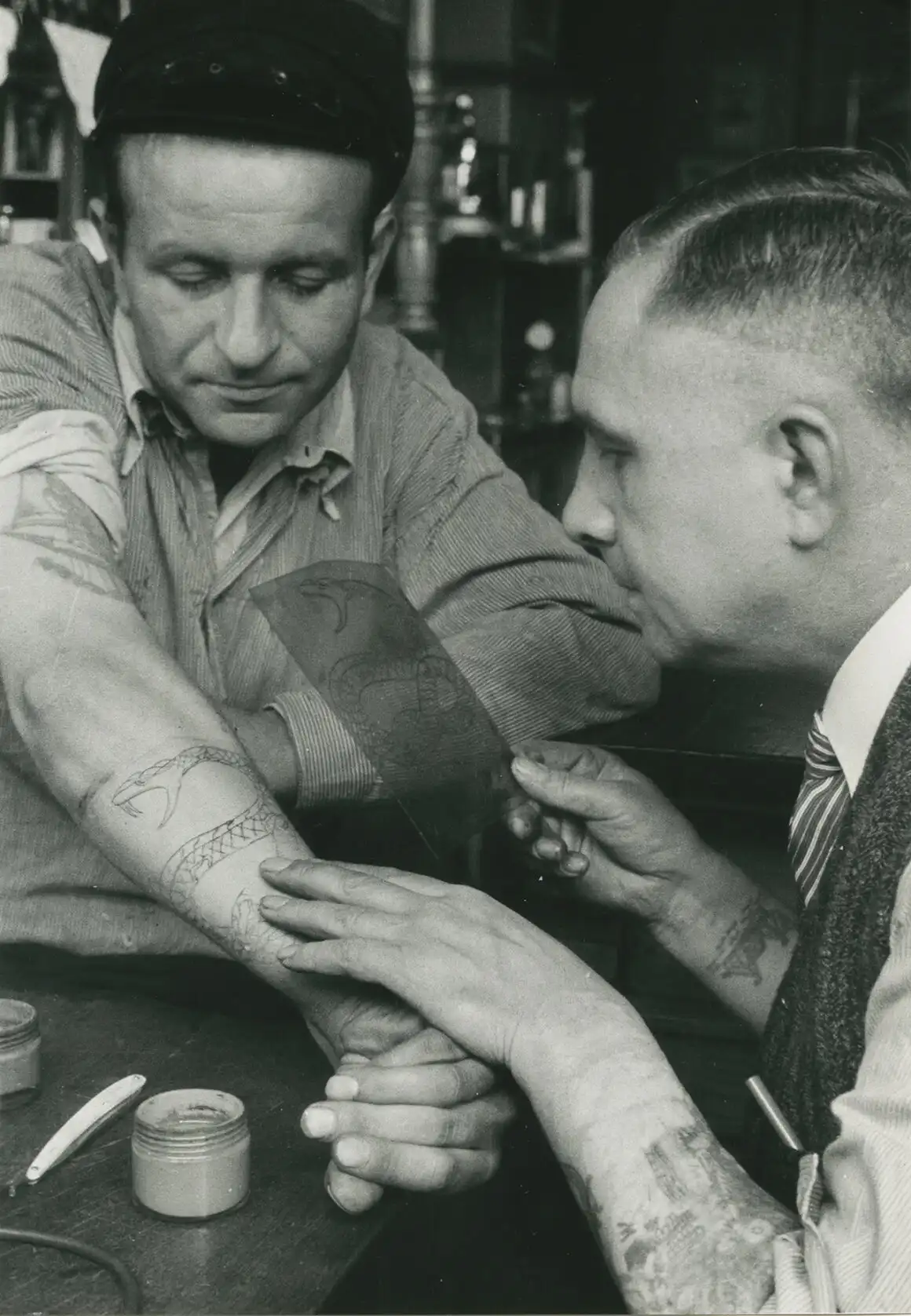 Christian Warlich applying a stencil on a customer, c. 1936